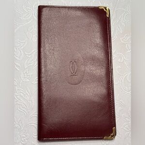 Cartier Must de Cartier Bordeaux/burgundy bi-fold wallet/passport holder.